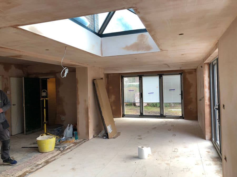 Extension interior mid-build with roof lantern installed and walls boarded